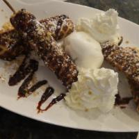 Belgian Waffles · Served with vanilla flan, chocolate and powdered sugar. Served with ice cream and whipped cr...