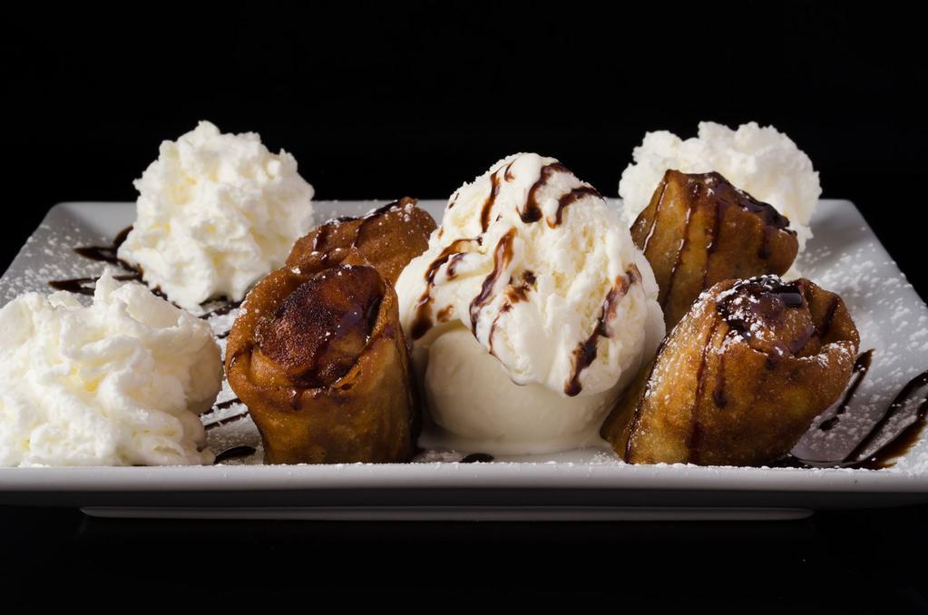 Apple Strudel · 4 pieces of crunchy eggroll filled with apples and raisins. Served with ice cream and whipped cream.