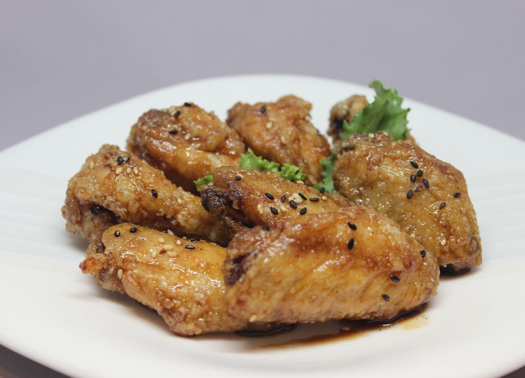 Black and White Sesame Chicken Wings · 8 Pieces of Chicken Wings marinated with sweet and spicy sauce with Black and White Sesame.