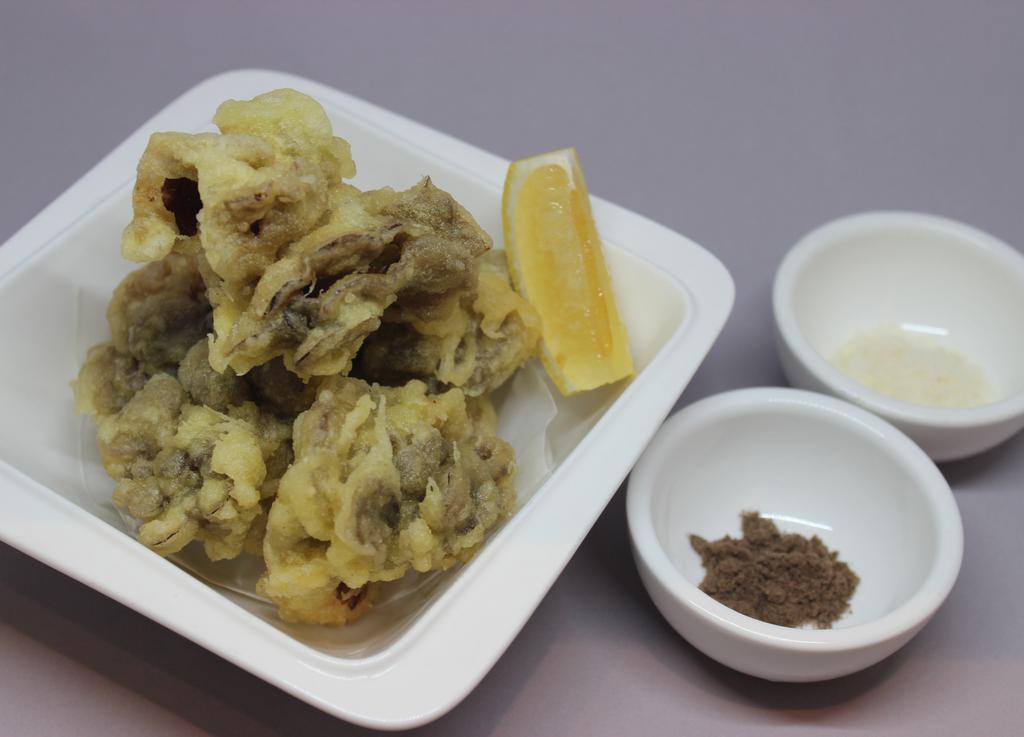 Maitake Tempura · 5 Pieces of Maitake mushroom Tempura with Truffle Salt and Parmesan Cheese.