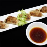 Gyoza · Pan fried pork and vegetable dumplings. 5 pieces.