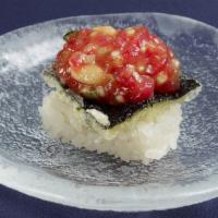 Yukke Tuna over Crispy Seaweed · Marinated Tuna. Contains PINE NUTS.