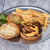 1/4 lb. Western Burger · With BBQ sauce, bacon, cheese and onion rings. Served with fries.