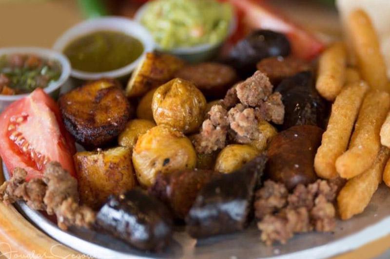 Picada  · Papa criolla, yuca, carne asda, pork, chorizo, morcilla, sweet plantain, arepa, chicharron, tomatoes, aiji, chimichurri and guacamole.