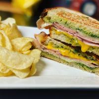 Redmond Panini · Homemade basil pesto sauce, Cheddar, Ham, and Roma tomatoes.
Grilled & potato chips on the s...