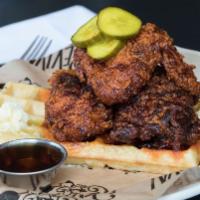 Chicken and Waffles · Served with honey butter and maple syrup.