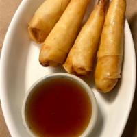 Shrimp Rolls · Deep fried marinated shrimp wrapped in rice paper served with plum sauce. 