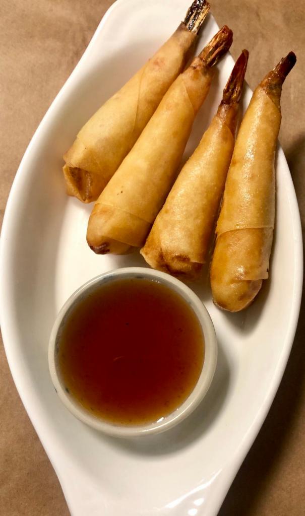 Shrimp Rolls · Deep fried marinated shrimp wrapped in rice paper served with plum sauce. 