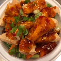 Tofu Deluxe · Fried tofu on steamed vegetable topped with special garlic chili sauce. Vegetarian. Veggie. 