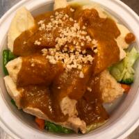 Rama · Red curry-peanut sauce on a bed of green vegetables. 