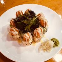 Paradise Roll · Spicy crabmeat , shrimp tempura, avocado inside, soypaper spicy crunchy, salmon, spring mix ...