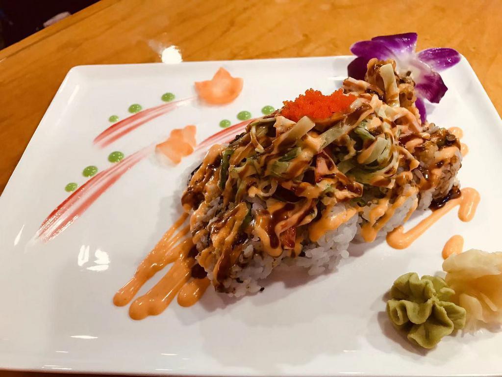 Lobster Roll · Tempura lobster & Asparagus inside, crabmeat, seaweed salad , served with eel sauce & spicy mayo