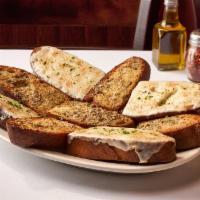 Garlic Bread · Thick Sliced Bread Topped w/ Garlic & Herb Butter (Vegetarian)