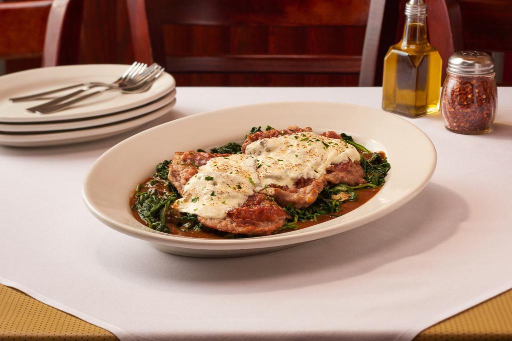Veal Saltimbocca · Thin Sliced Veal on a Bed of Sautéed Spinach Topped w/ Prosciutto & Melted Mozzarella in a Marsala Wine Sauce