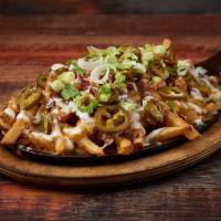 Trainwreck Fries (Large) · Melted cheddar, Jack cheese, smoked bacon, scallions and jalapenos with ranch dressing.