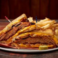 Texas Brisket Melt Sandwich · BBQ Sauce, Melted Cheddar & Grilled Onions on Tuscan Bread  -  Sides sold separately 