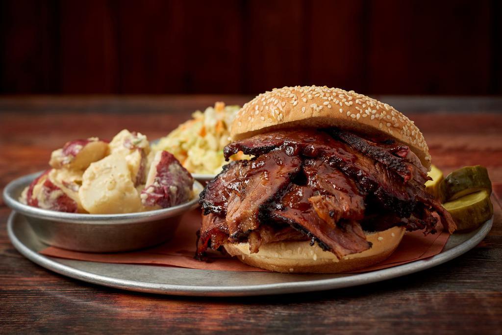 Texas Beef Brisket Sandwich · Perfectly seasoned and slow smoked until tender - Sides sold separately 