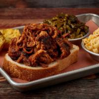 Carolina Pulled Pork Plate · Pork Smoked & Pulled Off the Bone & Tossed in our Famous Vinegar BBQ Sauce - Served w/ Choic...