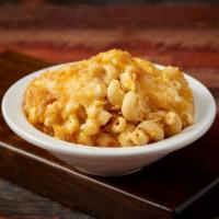 Mac and Cheese · Macaroni tossed with sharp cheddar, mustard, cream and a touch of hot sauce baked until bubb...