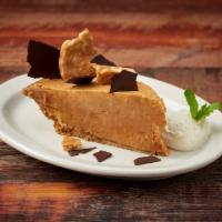 Slice Peanut Butter Pie · Smooth and creamy peanut butter mixed with whipped cream in a graham cracker crust.