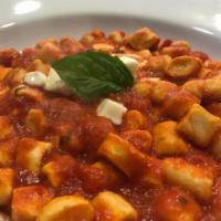 Gnocchi Sante Fe · Fresh artisan ricotta gnocchi with mozzarella and rustic tomato sauce.