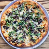 Pizza Mushroom & Truffle · Olive oil base, mozzarella, wild mushrooms, parmesan, truffle oil, topped with fresh arugula.