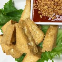 8 Piece Fried Tofu · Served with sweet chili sauce and peanut on top.