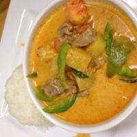 Pineapple Curry · Curry paste with coconut milk, pineapple, bell pepper, tomato and basil. Served with steamed...