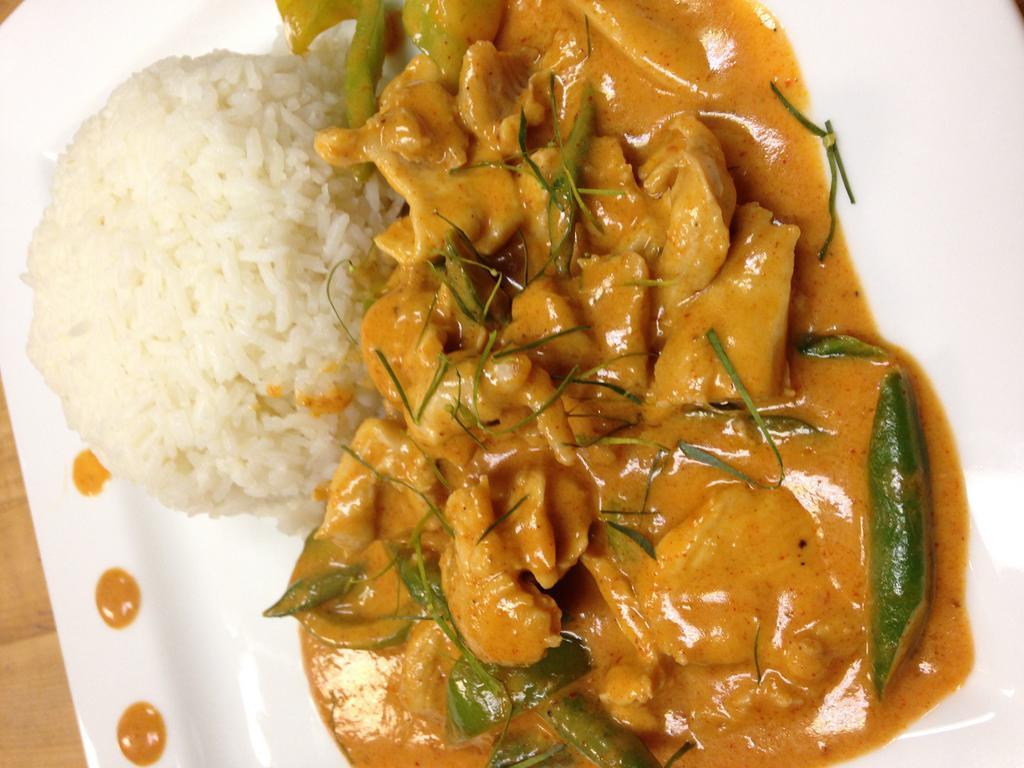 Panang Curry · Panang curry paste in coconut milk cooked with green bean and bell pepper. Served with steamed rice. Spicy.