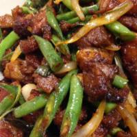 Pad Prik King · Stir fried green bean, onion, carrot, bell pepper and basil with red chili paste. Served wit...