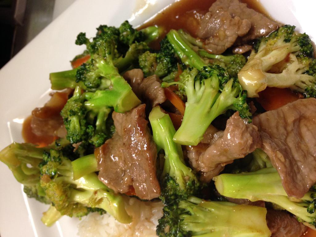 Fresh Broccoli · Stir fry with carrot in light brown sauce. Served with steamed rice.