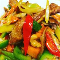 Mango Duck · Crispy duck topped with fresh mango sauce, apple, cashew nut, carrot and onion. Served with ...