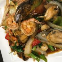 Seafood Basil · With steamed rice. Sauteed shrimp, squid, fish, scallop and green mussels with basil, onion,...