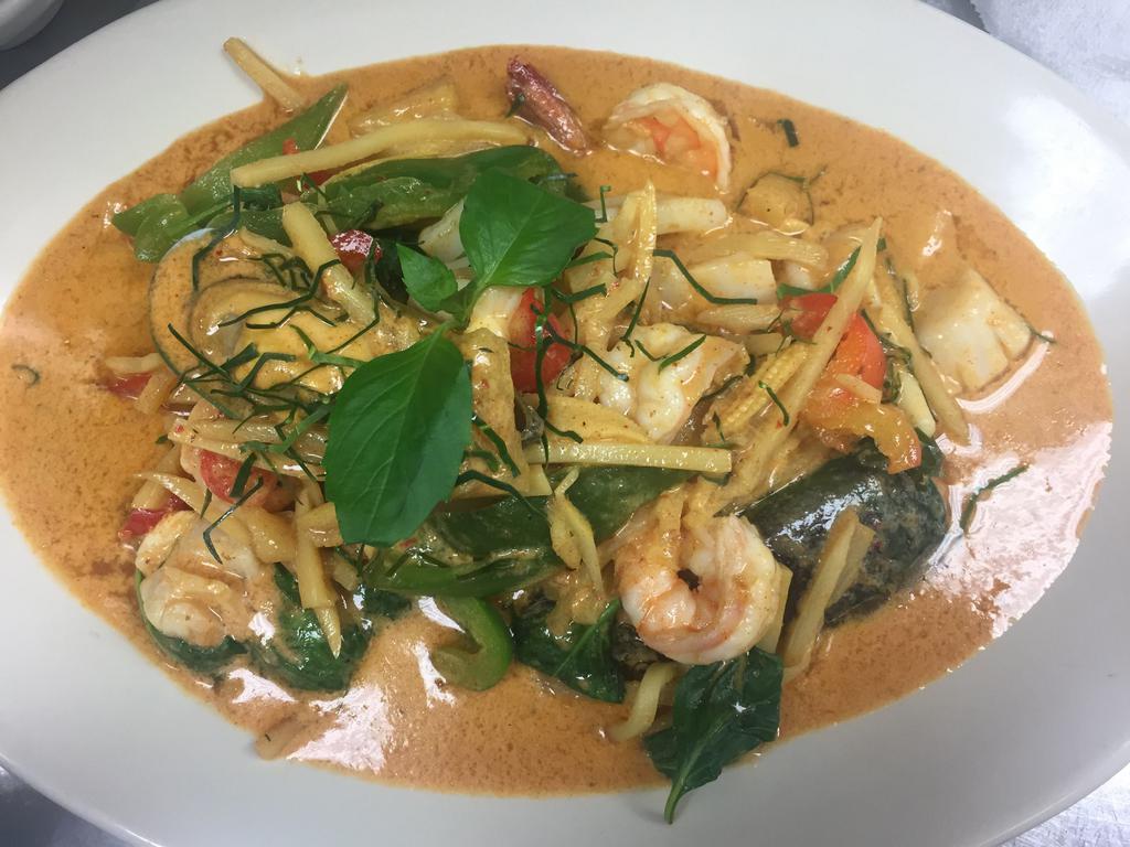 Seafood Curry · With steamed rice. Shrimps, squids, fish, scallop and green mussels, bell pepper, pineapple, bamboo shoot, baby corn in red curry sauce. Spicy.