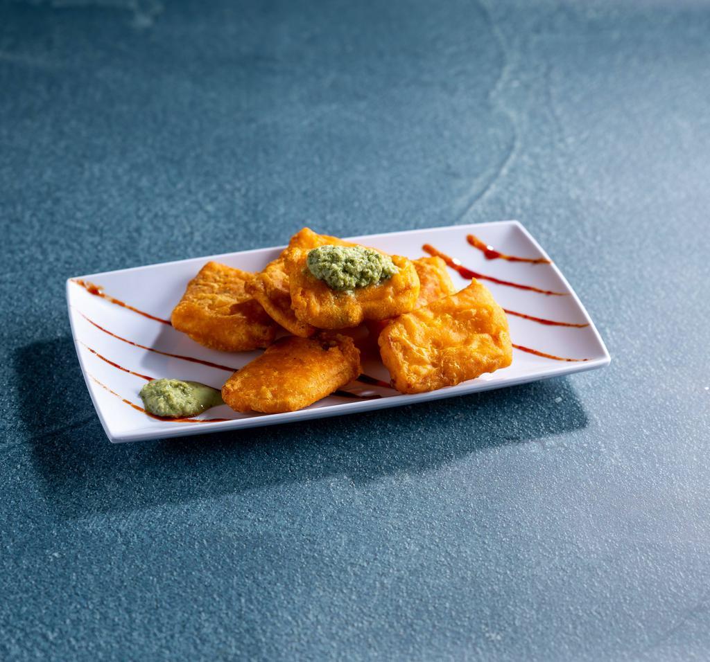 3. 8 Pieces Paneer Pakora · Pieces of homemade cheese dipped in garam and chick pea flour and deep fried.