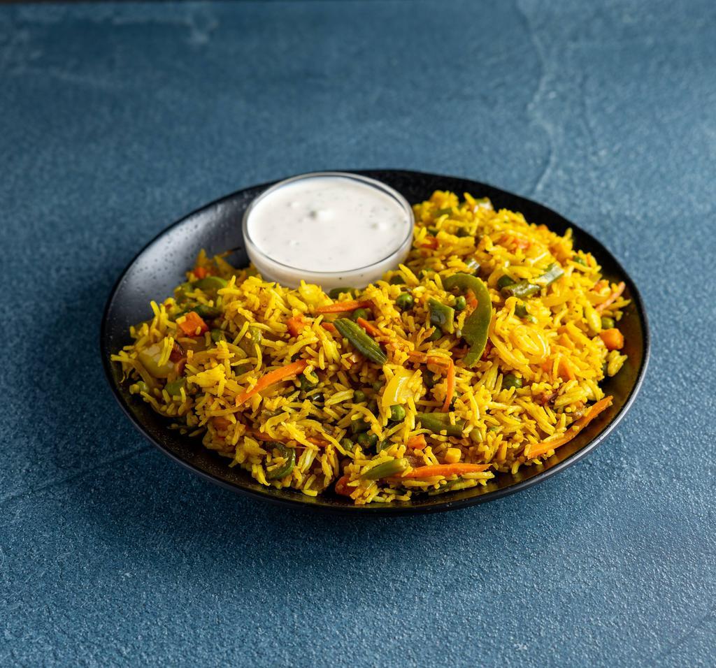 93. Vegetarian Biryani · Classic dish of curried rice with vegetables.