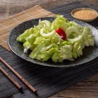 House Salad.. · Green salad with ginger dressing 
(Contains peanut butter)