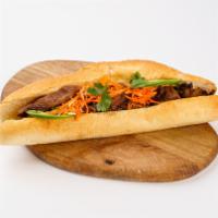 9A. Banh Mi · Vietnamese sandwiches freshly toasted baguette with mayonnaise spread, topped with jalapeno,...