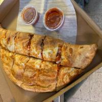 Chicken Parmesan Calzone · Comes with house marinara sauce and cheese.