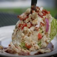 Wedge Salad  · Classic wedge featuring tomato, onion, bacon, blue cheese crumbles, blue cheese dressing and...