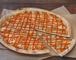 Buffalo Chicken Pie · Chicken marinated spicy buffalo sauce blended with blue cheese dressing and topped with 100%...