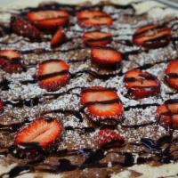 Nutella Pizza with Strawberries · Sliced strawberries, Nutella spread, chocolate drizzle and powdered sugar.