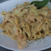 Fettuccine Alfredo · Fettucine pasta with creamy Alfredo sauce. Add chicken or shrimp for extra charge.