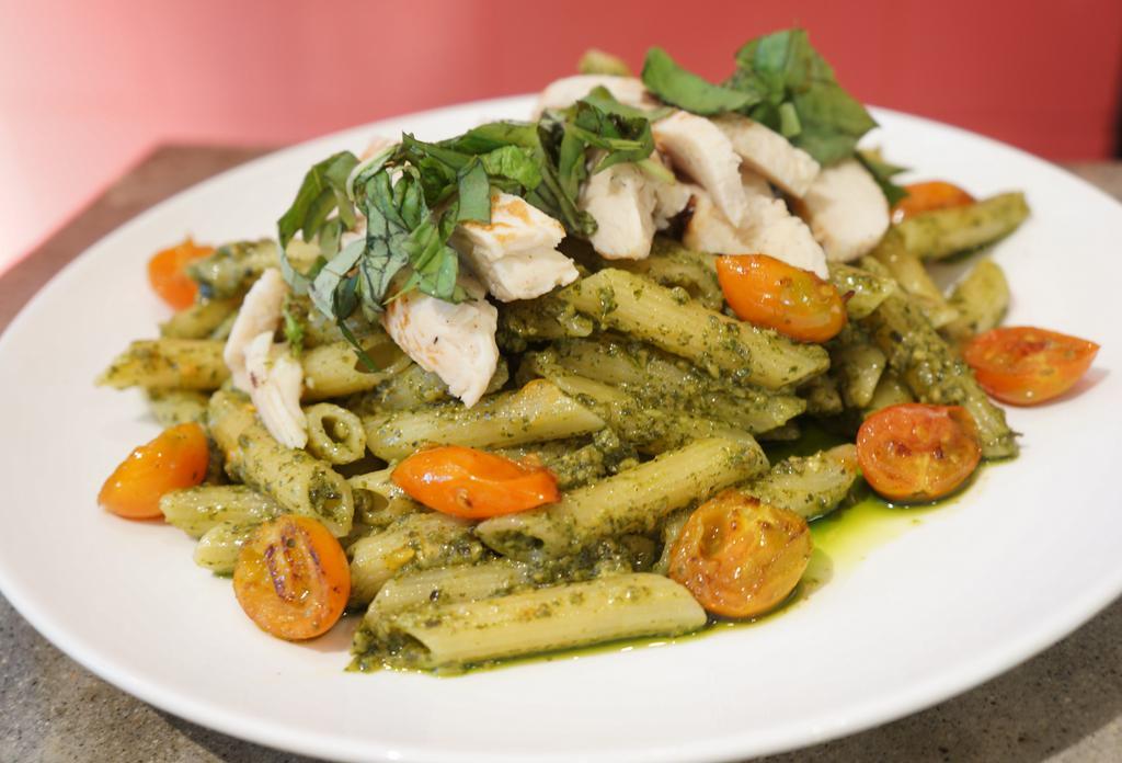 Penne Pesto · Penne, pesto, diced tomatoes, basil, Parmesan and chicken.