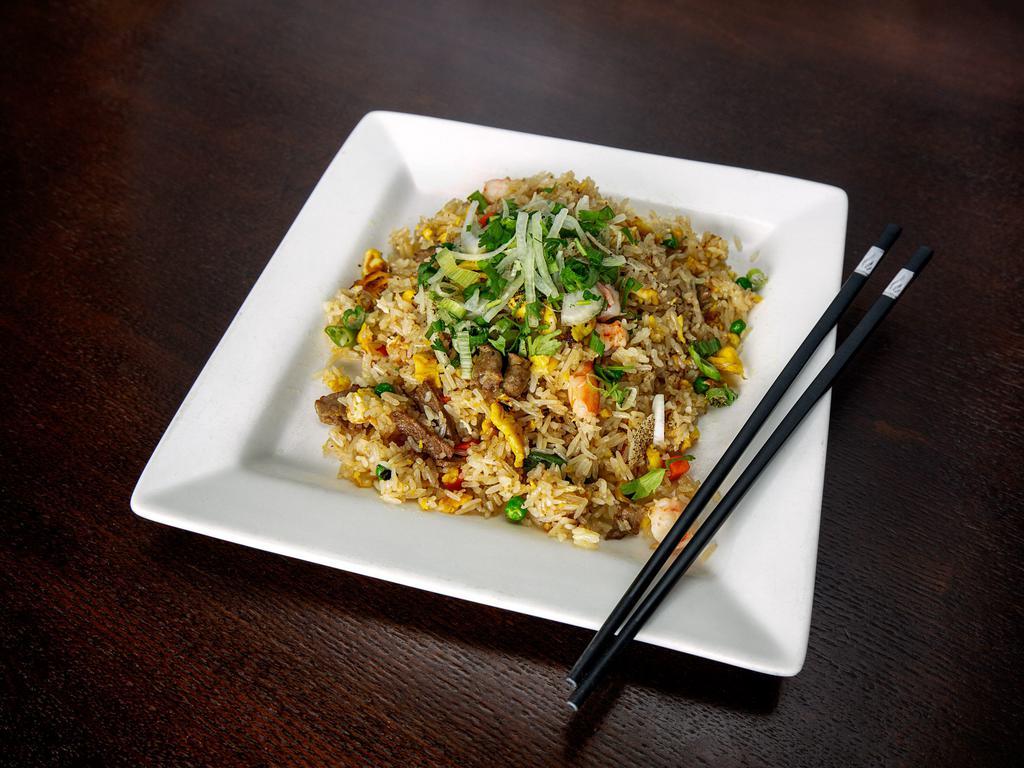 S39. House Special Fried Rice · House special fried rice with egg, peas, corn, diced carrots, and your choice of meat.
