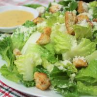 Caesar Salad · Heart of Romaine, Crunchy Croutons, Parmesan Cheese and Our Delicious Caesar Dressing.