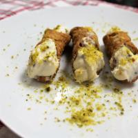 Cannoli · 3 pc. Filled with vanilla chocolate chip cream, sprinkled pistachios on top