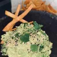 Guacamole And Chips  · Topped with onion, cilantro, and sesame seeds. Comes with a side of fried corn tortilla chips