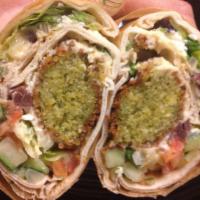 Falafel Handheld · Homemade blend of ground chickpeas and spices. Served on warm, hand-stretched pita