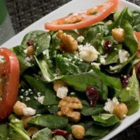 Spinach Salad · Spinach, tomatoes, garbanzo beans, walnuts, dried cranberries and goat cheese.